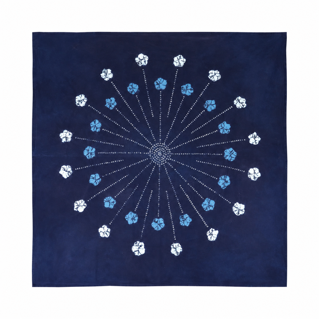 Large 110x110cm indigo tie-dye cotton mat featuring a central mandala firework pattern with radiant floral details, handcrafted Yunnan textile.